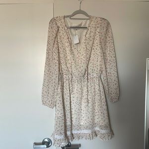 Selling NEW WITH TAGS Lucca floral dress. Perfect for spring/ summer!